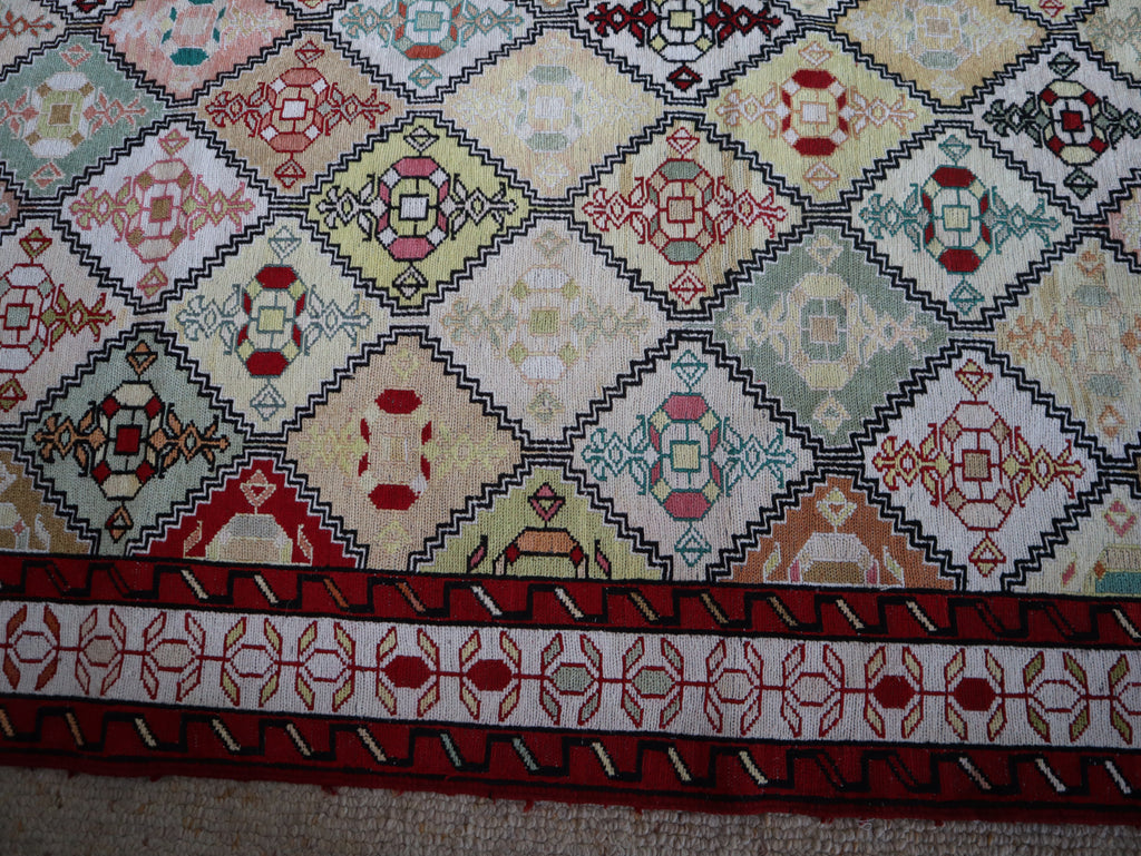 Close-up detail showing individual geometric motifs in naturally dyed silk