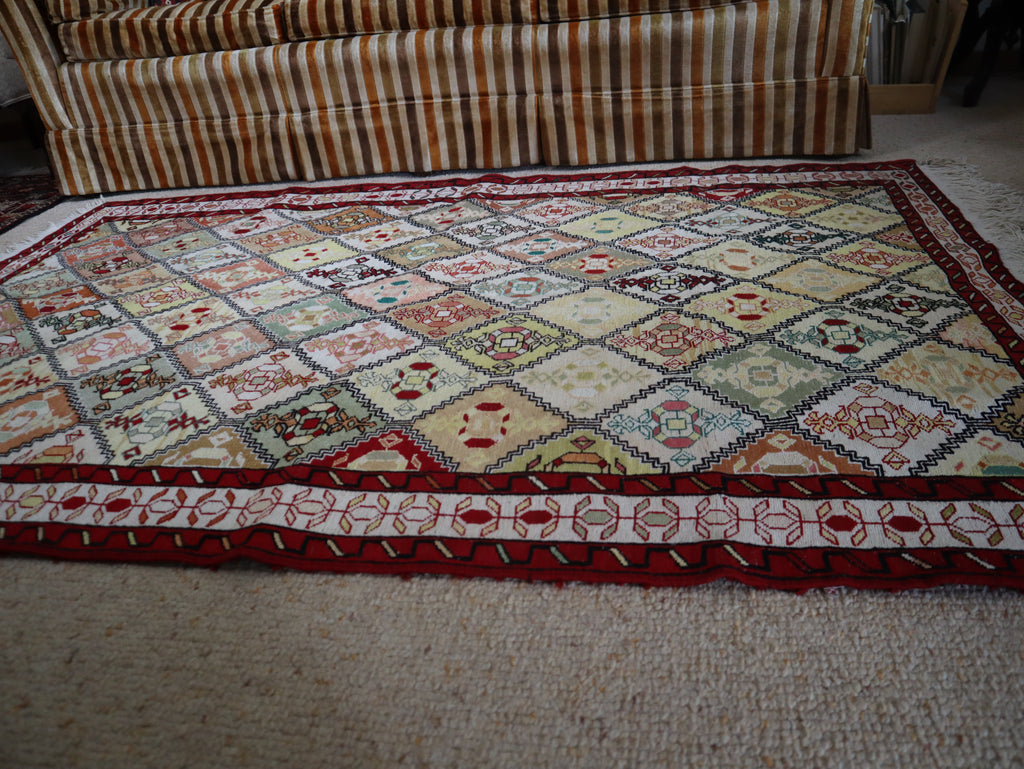 Soumak silk rug displayed in a living room setting
